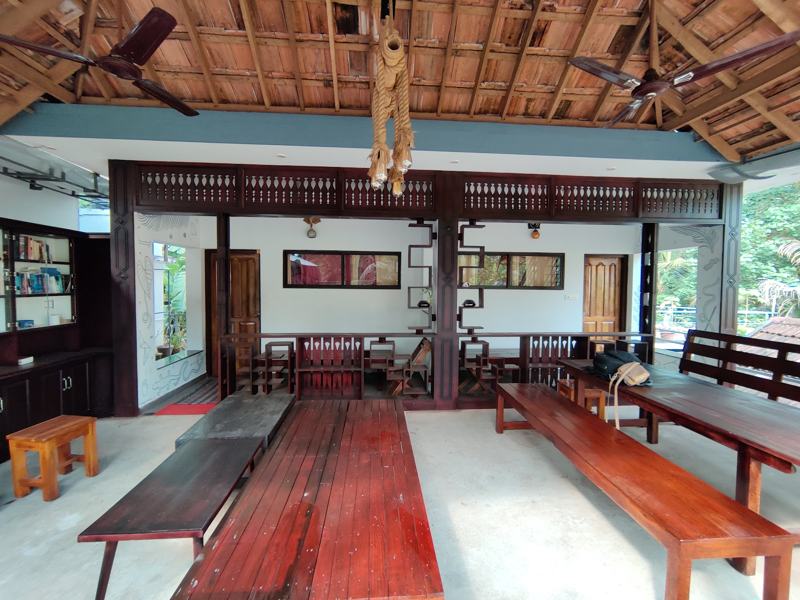 Open common hall with wooden tables