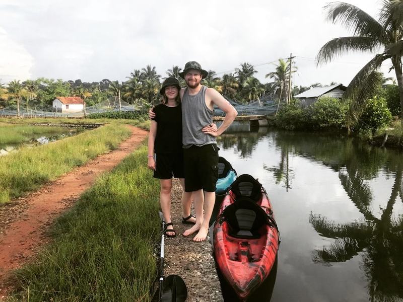Guests with a kayak beside the canal